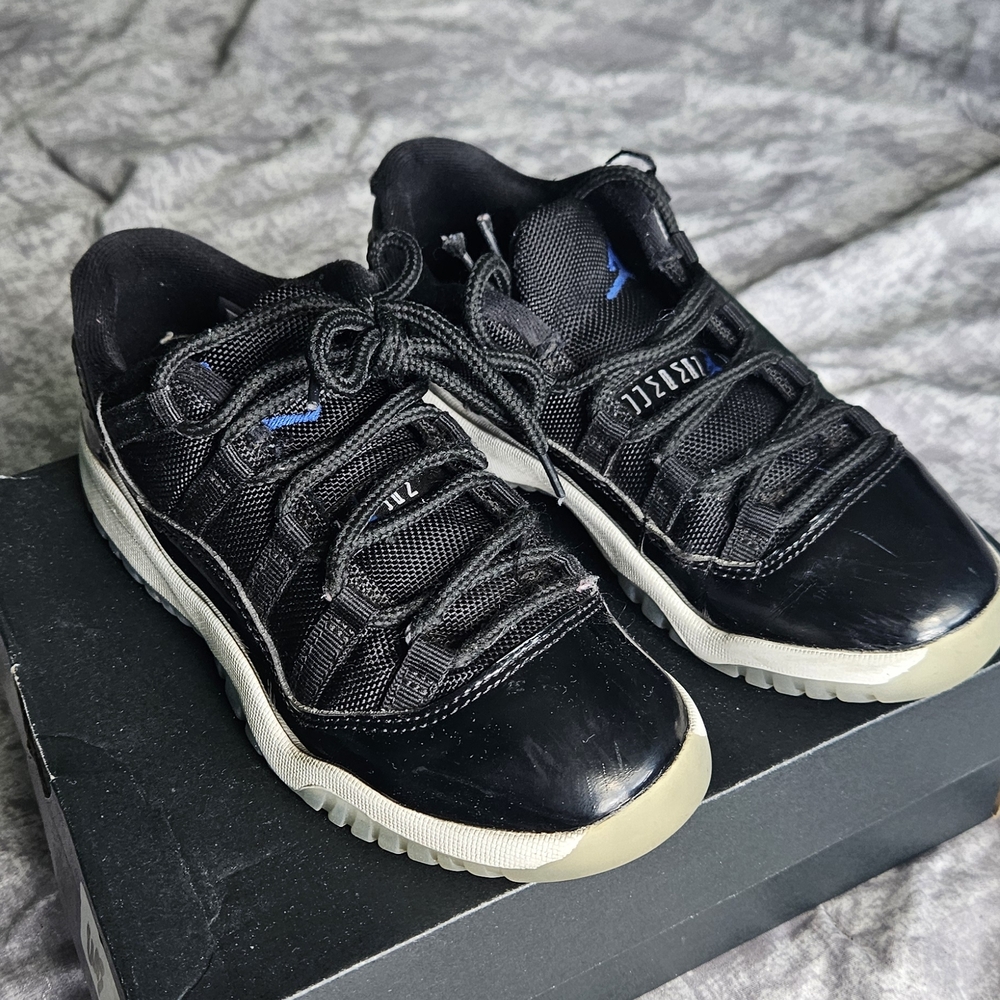 Jordan 11 Black Low-Top Patent Leather Sneakers